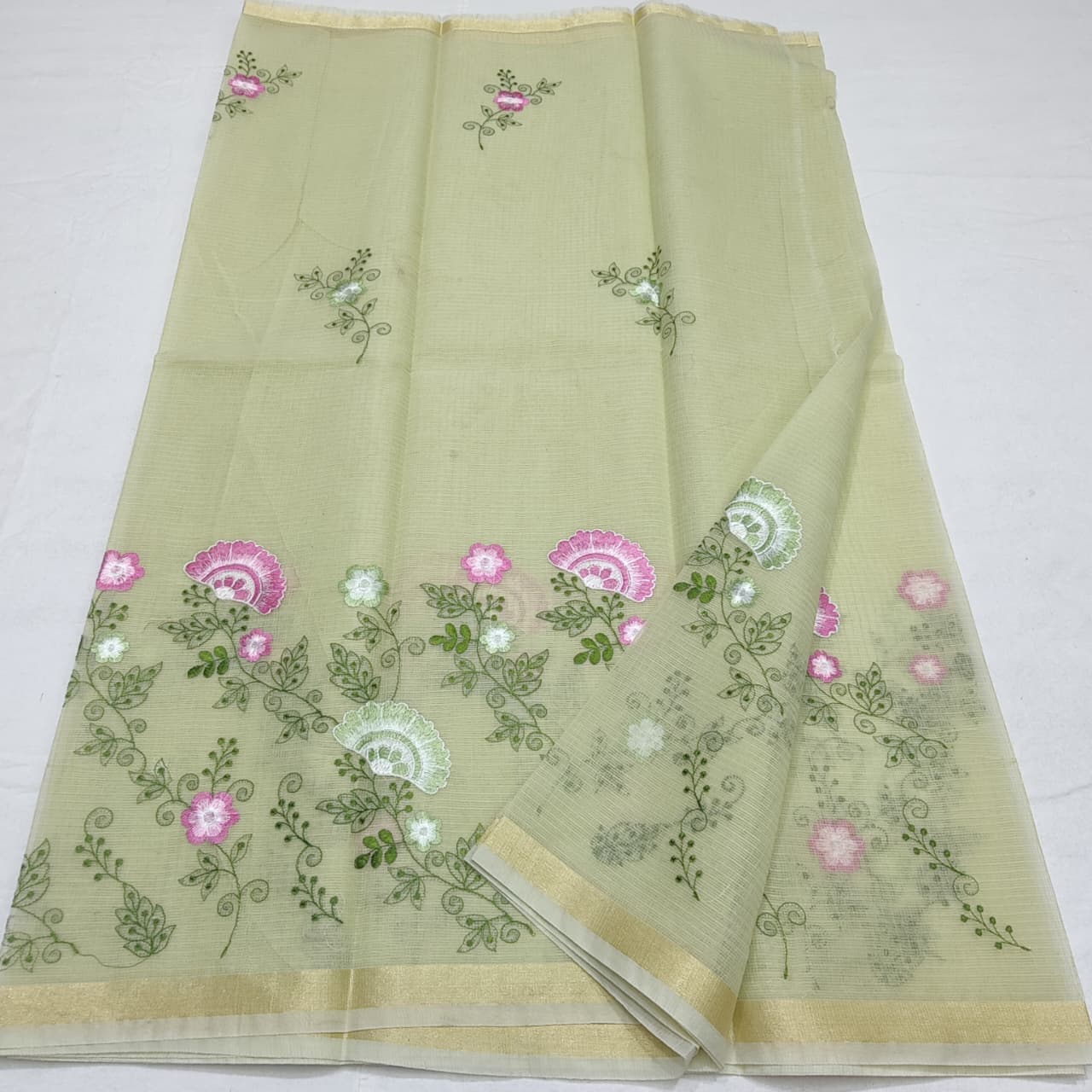 “Pastel Green Kota Cotton Saree with Floral Embroidery”